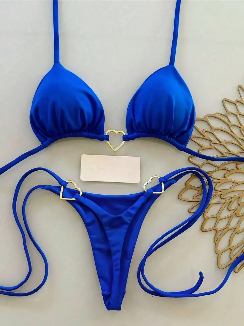 Traje de baño 2 piezas, azul con broches de corazon